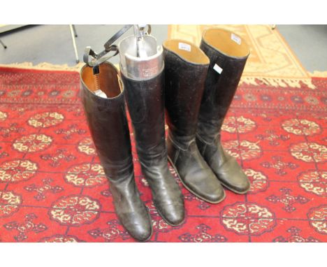 A pair of gentlemen's black leather hunting boots with metal trees and a pair of gentlemen's black rubber hunting boots (2)