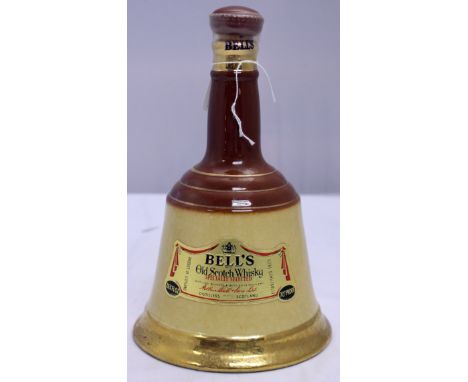 A 26 2/3 fl.ozs Bells Scotch whisky in ceramic bottle