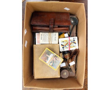 A motorists' leather bound First Aid Kit, playing cards, travelling inkwell, steak knives, together with a German carved bott