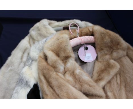 A blonde mink coat with a zip-off bottom section, making a 3/4 length coat, double lapel collar, full length sleeves, lining 