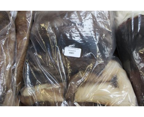 A collection of textiles comprising ladies' hat, fur stole, tippet and a further fur tippet (1 bag) 