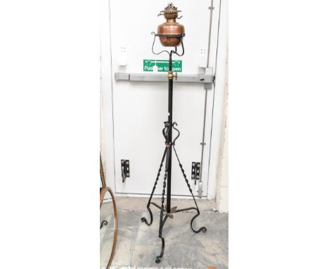 A wrought iron oil standard lamp, telescope action, 145 cm high approx. 