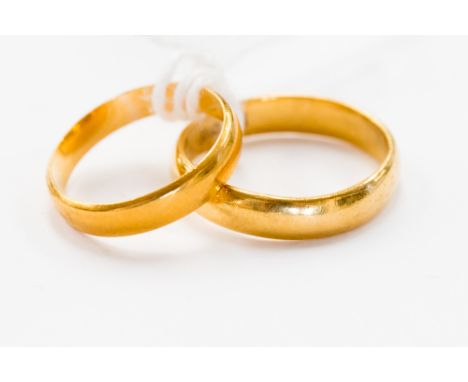 Two 22 ct yellow gold wedding bands, gross weight approx. 7.0 grms, ring sizes O½ and K 