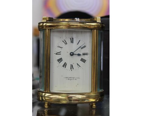 Garrard and Co, brass five glass oval carriage clock