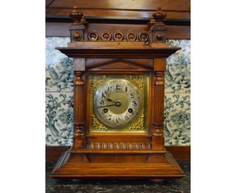 Late 19th/early 20th Century walnut and beech cased mantel clock, having a gallery top, brass dial with silvered chapter ring