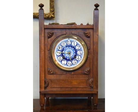 Late 19th Century walnut and beech mantel clock, the Aesthetic style ceramic dial having blue and white painted decoration an