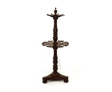 19th Century mahogany hunting boot rack standing on a turned pillar and platform tripod base with bun terminals   Condition: 