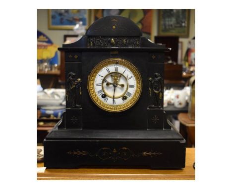 Victorian black slate cased architectural style mantel clock having classical decoration, the white dial with Roman numerals 