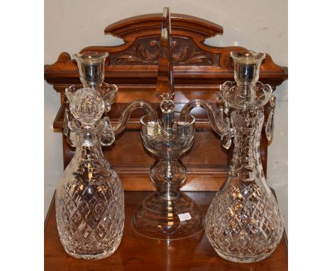 Cut glass two branch candelabra with lustre drop decoration together with a modern cut crystal decanter and a similar carafe 