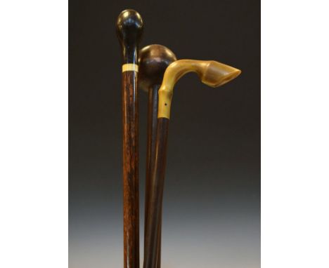 Knob keri, walking stick, the horn handle in the form of a horses hoof and one other walking stick   Condition: 