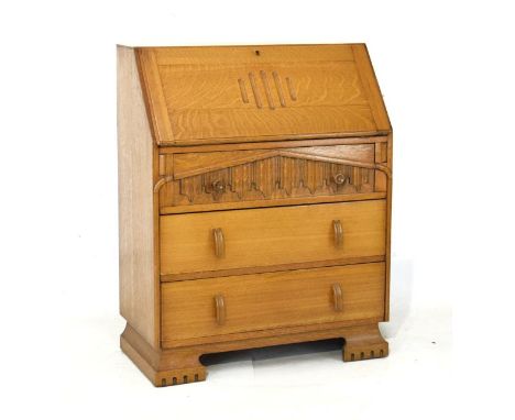 Light oak bureau, the fall flap enclosing a fitted interior, three long drawers below   Condition: 