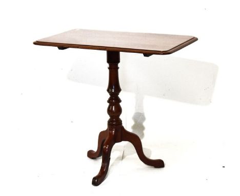 Victorian mahogany rectangular snap-top wine table standing on a turned pillar and tripod base   Condition: 