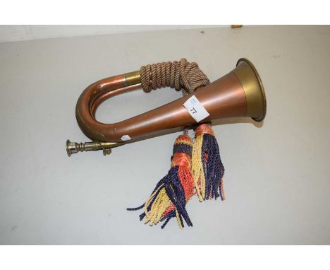A copper and brass bugle with tassel decoration, unmarked