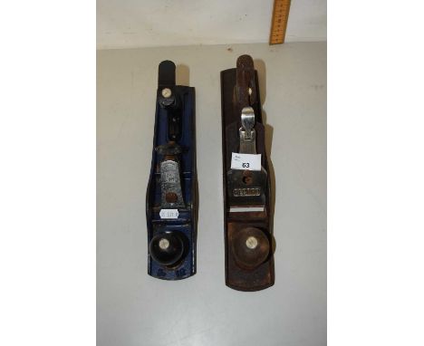 A vintage woodworking plane and one other