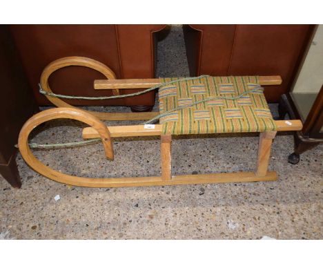 A vintage wooden framed sleigh