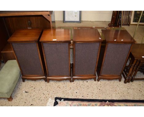 A set of four mahogany veneered speaker cabinets