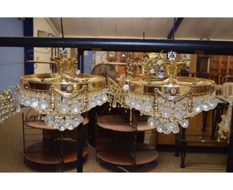 A pair of contemporary circular brass finish and glass ceiling light fittings, 30cm diameter