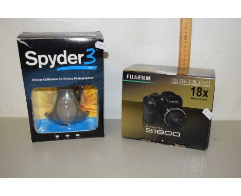 A Fuji Film S1800 camera together with a Spyder display calibrator