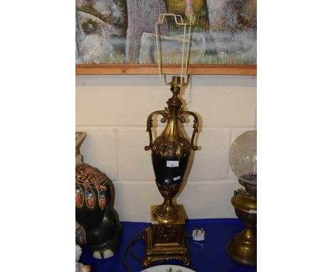 A brass and composition table lamp with vase formed stem