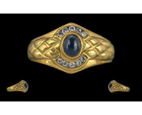 Ladies 18ct Gold Sapphire and Diamond Set Dress Ring. Marked 750 to Interior of Shank. The Central Blue Sapphire ( Cabouchon 