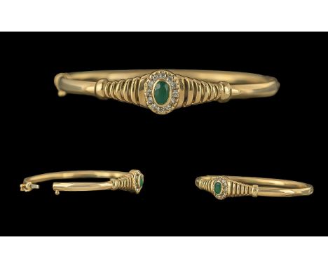 Edwardian Period Ladies 9ct Gold Hinged Bangle Set with Central Emerald, Surrounded by Diamonds, Tests 9ct Not Marked. The Em
