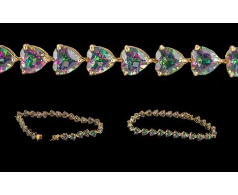 9ct Gold Tennis Style Bracelet Set with Mystic Topaz, weight 9.1 grams.