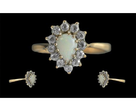 Ladies 9ct Gold Opal and CZ Set Cluster Ring, Full Hallmark to Interior of Shank. The Central Opal of Pleasing Colours, Surro