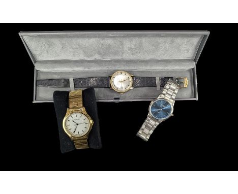 Three Gentlemen's Quality Wristwatches, comprising a vintage Bulova Caravelle automatic watch with white face, gold baton num