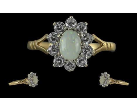 Ladies Attractive 9ct Gold Opal and CZ Set Cluster Ring. Full Hallmark to Interior of Shank. The Central Milky Opal Surrounde