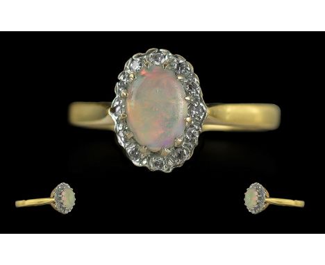Ladies 18ct Gold Opal and Diamond Set Cluster Ring, Full Hallmark to Interior of Shank. The Central opal Surrounded by 16 Sma