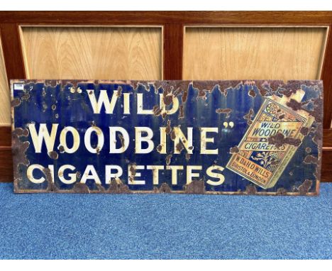 Cast Iron Enamel Sign 'Wild Woodbine Cigarettes', as found condition.  Measures 18" x 48".  Looks period.