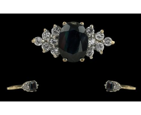 Ladies 9ct Gold Pleasing Diamond &amp; Sapphire Set Ring, full hallmark to interior of shank.  The blue Sapphire flanked by 1