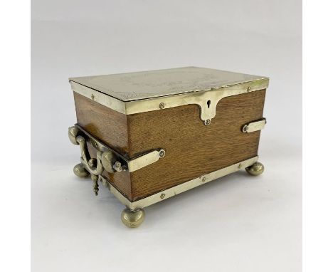 Plated and oak tea caddy, the plate lid engraved, with plate fittings, on round pad feet and hinged handles to the sides, the
