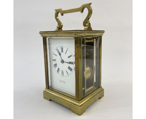 Brass carriage clock, the scroll and bar handle inscribed 'Simmons, Cheltenham', with striking movement, 19cm high&nbsp;