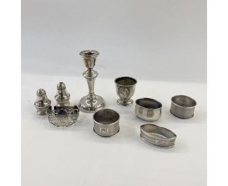 A 1950's silver mounted short candlestick Birmingham 1954, a foreign silver eggcup with relief portrait of a gentleman and da