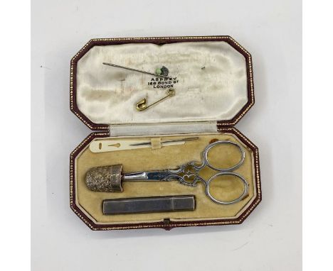 1930's travelling sewing kit with silver thimble, silver needle case in a marked Asprey London box 12cm long