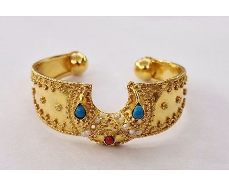 Indian gold bangle set with turquoise, red and seed pearls, gold relief decoration to the bangle, 32g approx. total&nbsp;
