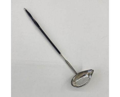 George IV silver toddy ladle with ebony handle and silver finial, London 1829, maker's mark worn 'F.M(?)', 38cm long&nbsp;