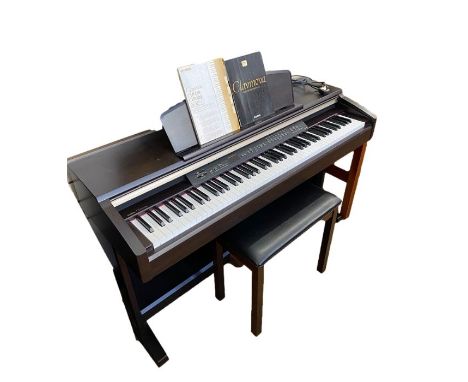 Yamaha Clavinova CLP-130 electric piano in dark wood stained case and the matching black-topped Yamaha stool, with owner's ma
