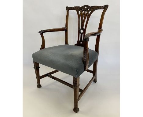 Georgian-style carver open armchair in Chippendale-style with foliate scroll and ribbon carved serpentine top rail, pierced v