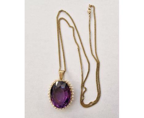 Gold-coloured pendant set with oval amethyst surrounded by seed pearls (unmarked), on 9ct gold chain, chain approx. 5g, ameth