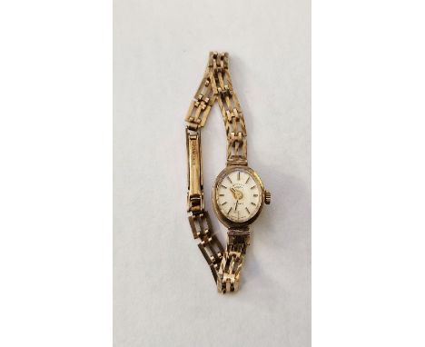 Lady's Rotary 9ct gold wristwatch&nbsp;with oval champagne face, on integral pierced rectangular link gold bracelet, 12g tota