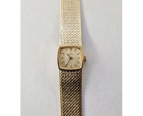 Mid 20th century lady's Omega 9ct gold wristwatch, the rounded square champagne face with integral mesh bracelet, 1968, 30.8g