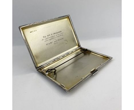 A 1930's silver cigarette case, engine turned inscribed 'to Dr. P. Hudson in appreciation of his care and unfailing attention