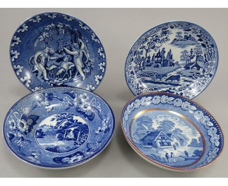 A group of early nineteenth century blue and white transfer-printed saucers, c.1820-30. To include: A Tavern Scene saucer, an