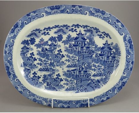 An early nineteenth century blue and white transfer-printed Spode Tall Door pattern large platter, c.1820.  It is decorated w