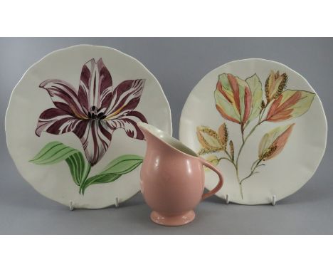 Two early twentieth century art deco period Clarice Cliff, Newport Pottery plates and a Clarice Cliff, Wilkinson jug, c. 1910
