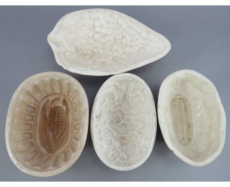 A group of early nineteenth century earthenware medium-size jelly moulds, c.1820-40. To include: a Spode (marked) grapes moul