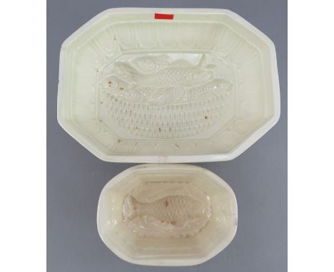Two early nineteenth century creamware jelly moulds, c.1800-20. Both depict designs of fish, one mould stands on three feet a