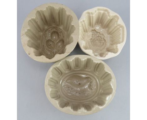 A group of nineteenth century, Victorian light brown-glaze earthenware jelly moulds, c.1870-1900. To include a bird mould, a 